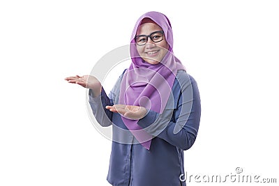 Muslim Lady Presenting Something on Her Side with Copy Space Stock Photo