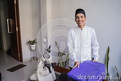 Muslim male travelling for eid mubarak lebaran by motorcyle Stock Photo