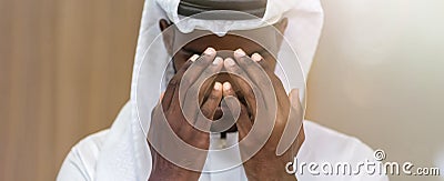 Muslim man having worship . Arab Muslim man praying in mosque stretching palms up. Moslem pray Stock Photo