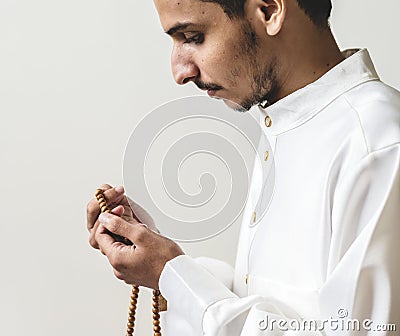Muslim man with prayer beads Stock Photo