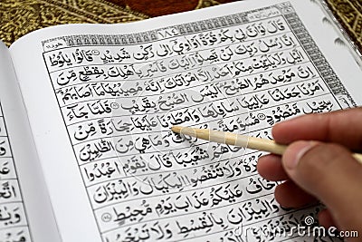 Holy Al Quran and prayer beads on the prayer mat Editorial Stock Photo