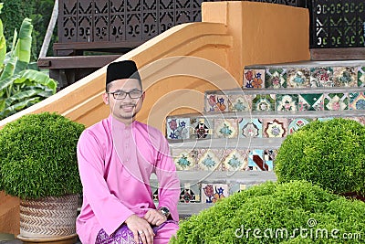 A muslim man with traditional baju melayu Stock Photo