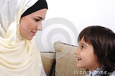 Muslim mother and son relaxing Stock Photo