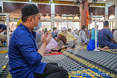 Muslim people offer Friday prayers at Muadzam Shah Mosque Editorial Stock Photo