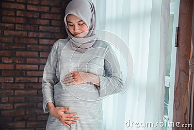 Muslim pregnant woman asian Stock Photo