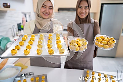 muslim small business owner making homemade nastar snack to sel Stock Photo