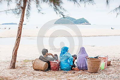 Muslim travelling, Rear view of Muslim family while picnicking Editorial Stock Photo