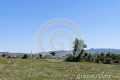 a muslim turkish village in turkey anatolia, view of mosque minaret in the village Stock Photo