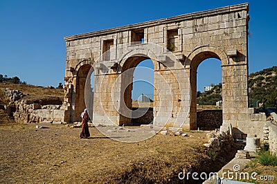 A Muslim woman admires the ruins of the ancient Greek city of Patara. Editorial Stock Photo