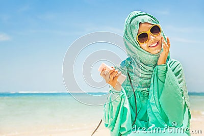 Muslim woman on a beach Stock Photo