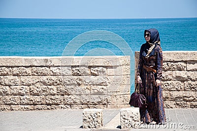 Muslim woman on the embankment of Tel Aviv, Israel Editorial Stock Photo
