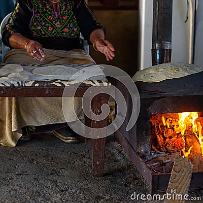 Muslim woman making food. Stock Photo