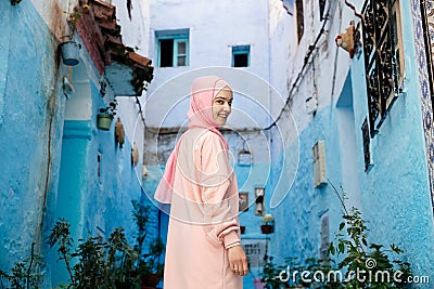 Tourist on a blue street in Chefchaouen, Morocco Stock Photo