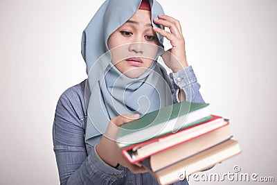 Muslim Woman Sick and Tired Reading Too Much Books Stock Photo