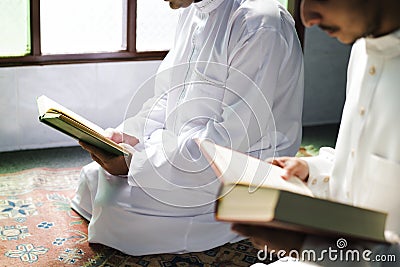 Muslims reading from the Quran Stock Photo