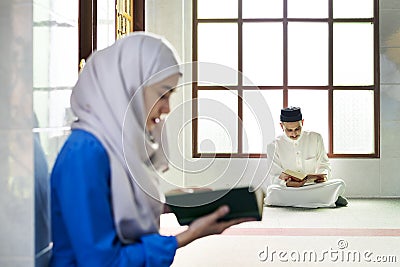 Muslims reading from the quran Stock Photo