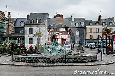 The mussel gatherers statue in center of medieval fishing village of Honfleur, Normandy, France Editorial Stock Photo