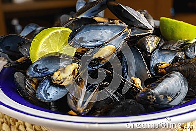 Mussels steamed in their juice with lemon. Mediterranean food, Spain Stock Photo