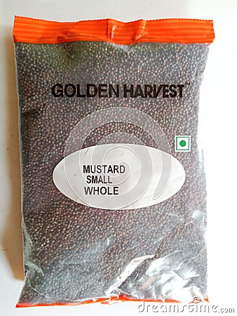 Mustard small whole in transparent packet for sale Stock Photo