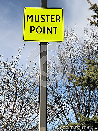 Muster point sign for people to meet during emergencies Stock Photo