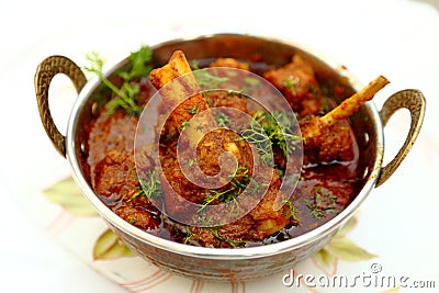 Mutton meal in copper bowl Stock Photo