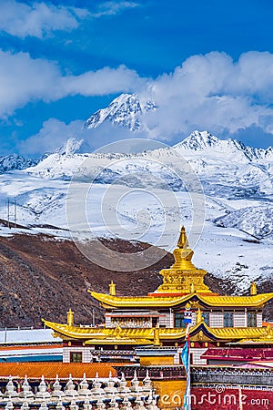 Tibetan temple under the snow mountain Stock Photo