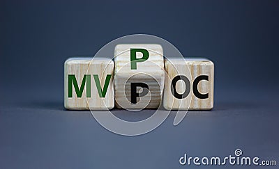 MVP vs POC symbol. Businessman turns the cube. changes words MVP, minimum viable product to POC, proof of concept. Beautiful grey Stock Photo