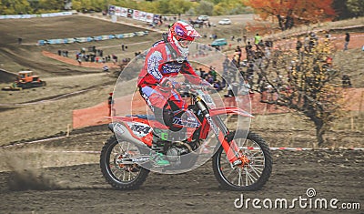 MX moto cross racing - Girl Bike Rider riding on dirt track - extreme jump. Extreme Motocross . Editorial Stock Photo