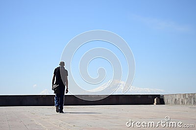 My black friend is looking to the Yerevan city, Armenia Editorial Stock Photo