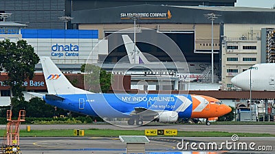 My Indo Airlines Boeing 737 freighter taxiing at Changi Airport Editorial Stock Photo