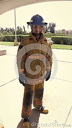 My job is extinguish fires. On guard. Firefighter with uniform and helmet. Masculinity and male job. Manly duty. Fireman Stock Photo