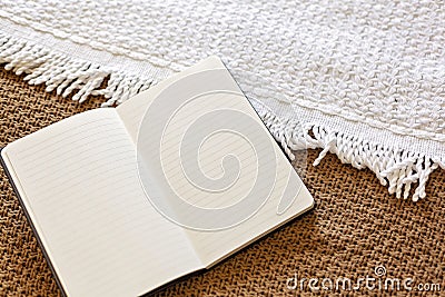 My love diary - The daily journal. Personal diary on knitted woolen textile. Keeping a Diary or Journal recording everyday Stock Photo