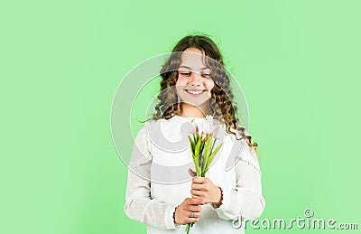 For my mom. Happy womens day. Celebrate childrens day. Gift for mothers day concept. Little girl tulips flowers. Happy Stock Photo