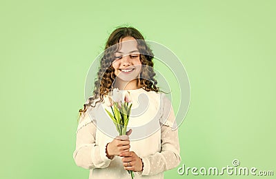 For my mom. Happy womens day. Celebrate childrens day. Gift for mothers day concept. Little girl tulips flowers. Happy Stock Photo