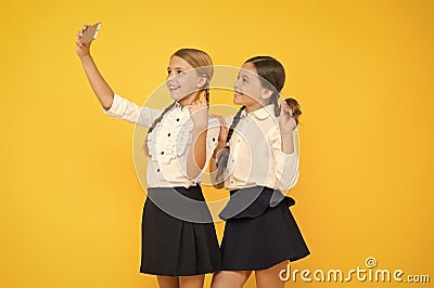 For my profile. kids make selfie photo, friendship. small girls in school uniform. back to school. educational blog Stock Photo