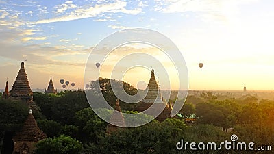 Sunrise in Bagan top view with hot air ballooons flying on a horizont Stock Photo