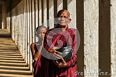 Myanmar Monk and his Disciple Editorial Stock Photo