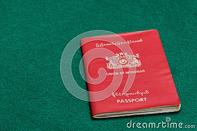 Myanmar passport on green table Stock Photo