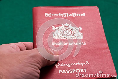 Myanmar passport in hand Stock Photo