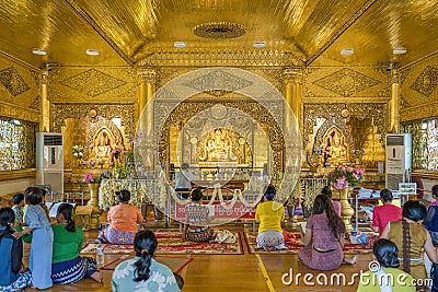 Myanmar people worship and pray in temple of golden Buddha at Mahar Shwe Thein Daw pagoda Editorial Stock Photo