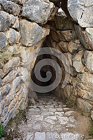 Mycenae and Tiryns archaeological site. The entrance to the dung Stock Photo