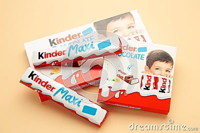 Mykolaiv, Ukraine - July 28, 2023: Kinder chocolate bars on beige background.Kinder bars are produced by Ferrero founded in 1946 Editorial Stock Photo