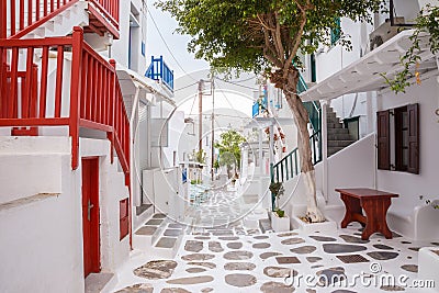 Mykonos town streetview with tree and red banisters, Mykonos town, Greece Stock Photo