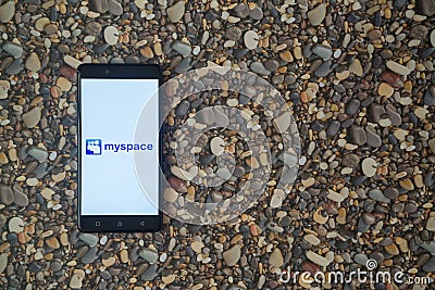 Myspace logo on smartphone on background of small stones Editorial Stock Photo