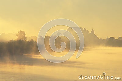 Mysterious Castle In Foggy Autumn Stock Photo