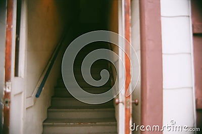 Mysterious Dark Staircase in Doorway Stock Photo