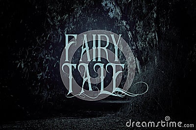 mysterious fairy tale background of dark and haunted forest with text. Stock Photo