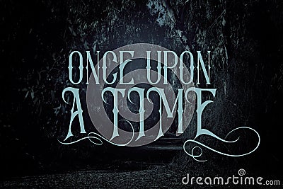 mysterious fairy tale background of dark and haunted forest with text. Stock Photo