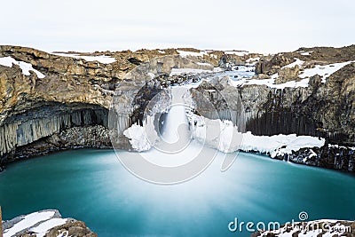 Mysterious huge waterfall among mountain Stock Photo