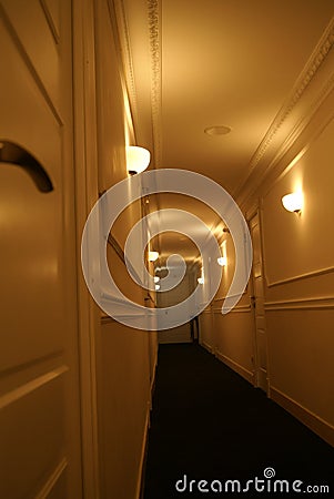 Mysterious and long hotel corridor Stock Photo